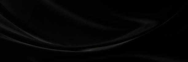 istock Black gray satin dark fabric texture luxurious shiny that is abstract silk cloth panorama background with patterns soft waves blur beautiful. 1409245295