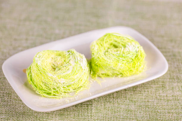 Green pulled sugar or bird nest or Dragon Beard candy. Also known as Semang in Malaysia. stock photo