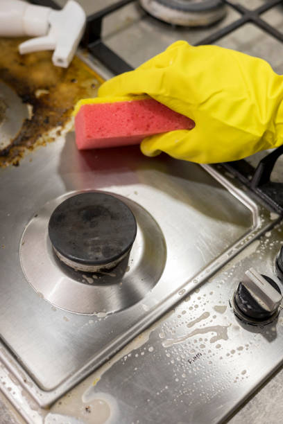 istock dirty kitchen stove, empty and full bottles of detergents around. 1409247936