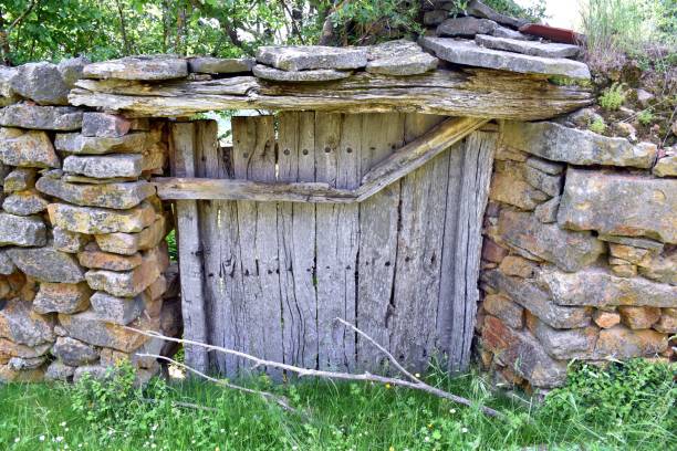 istock Old wooden gate in abandoned vegetable garden. 1409251560