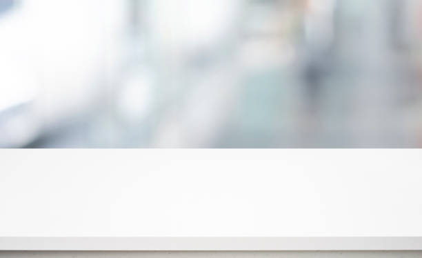 istock Selective focus of white table top on blur abstract background,window. 1409254776