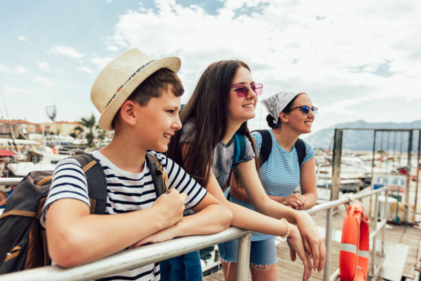 istock Family walking together at seacoast 1409255341