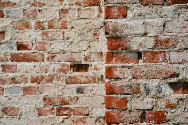 minimalistic horizontal stone background. corner of dilapidated building close up. old brick wall with cement. - corner stone wall brick imagens e fotografias de stock