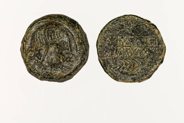 istock Ancient Roman bronze coin. Obverse and reverse - blank background. 1409259465