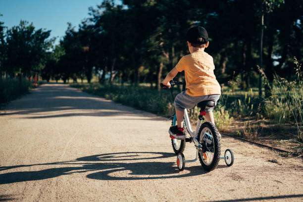 istock Little boy riding a bike 1409262943