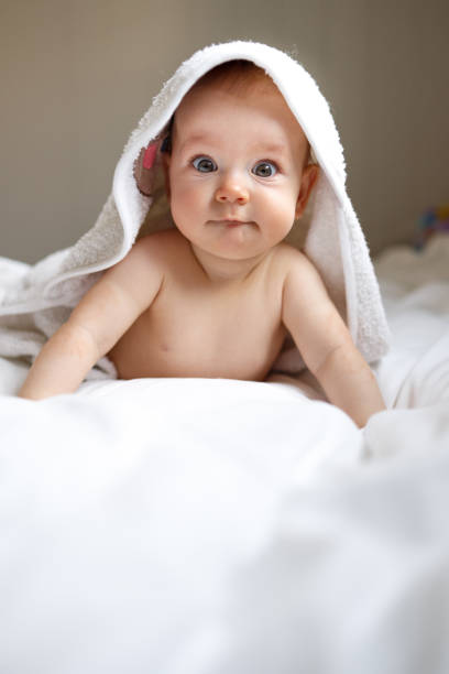 istock Baby wearing towel after bath 1409263869
