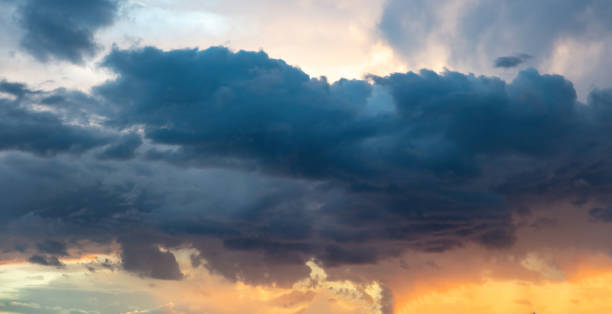 istock Twilight light color the cloudy sky. Cloud on blue sky background. Cloudscape grey and orange shade. 1409265445