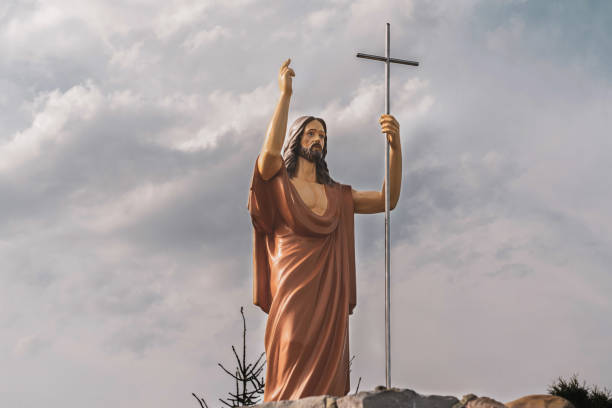 istock The statue of Jesus Christ with a cross (Christianity concept) 1409267064