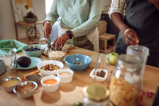 istock Unrecognizable couple making a smoothie in domestic kitchen 1409268232