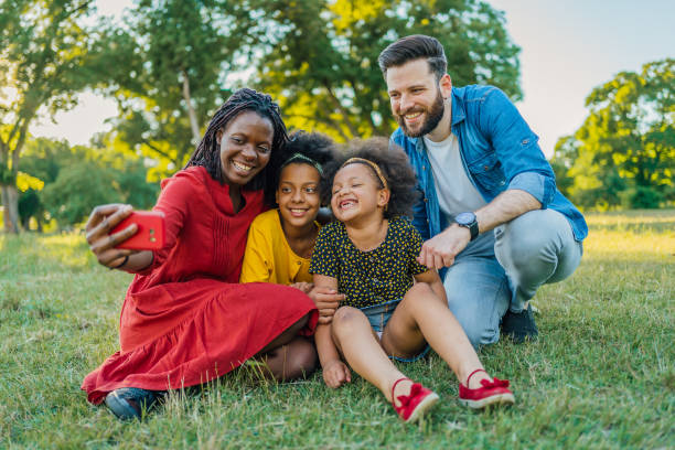 istock Multiracial family taking a selfie 1409268620