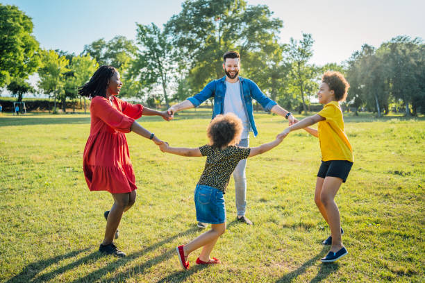 istock Multi ethnic family playing ring around the rosy 1409269772