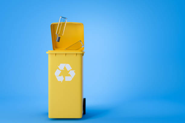 istock Yellow recycle bin with glass. Copy space 1409269831