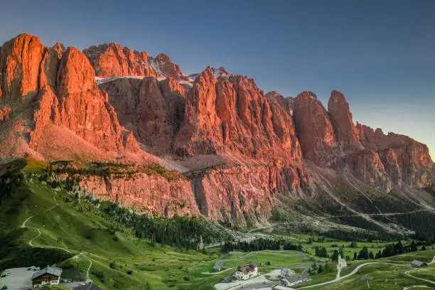 Passo Gardena in Dolomites at red sunset, Italy, Europe