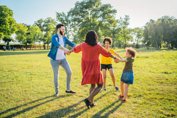 istock Multi ethnic family playing ring around the rosy 1409269881