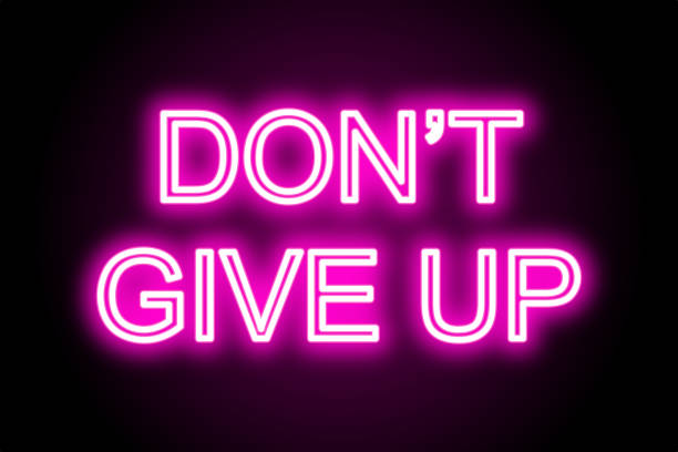 istock Motivational neon text don’t give up on black background 1409271038