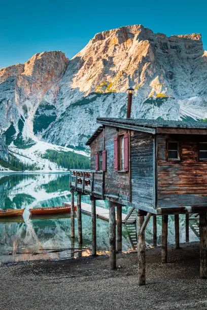 Lago di Braies and old hut at sunrise, Dolomites, Italy