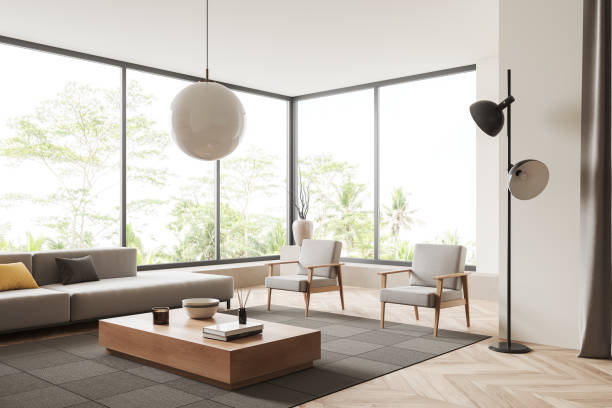 istock Light lounge zone interior with two armchairs and couch, panoramic window 1409271134