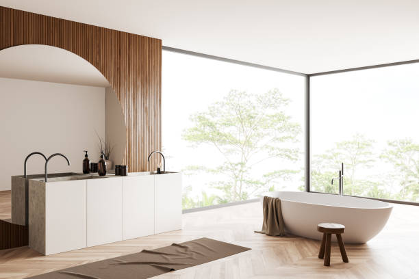 istock Light bathroom interior with bathtub, sink, accessories and panoramic window 1409271378