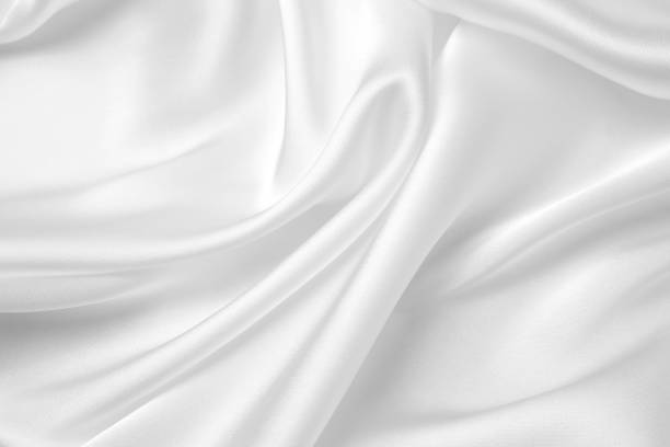 istock Smooth elegant white silk or satin luxury cloth texture can use as wedding background. Luxurious background design. 1409271418
