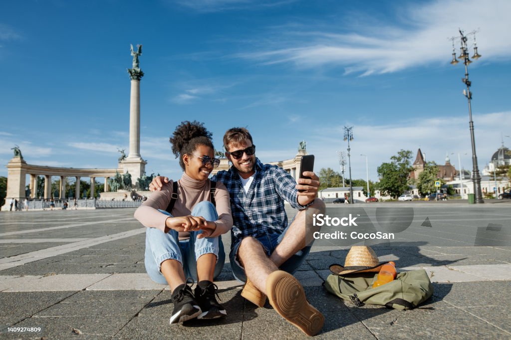Multi ethnic couple on city break in summer. Couple visiting Budapest, Hungary Couple enjoying spring city break in Europe Budapest Stock Photo
