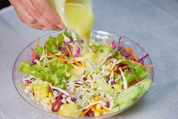 istock Bowl of salad with dressing 1409277324