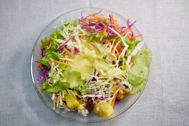 Bowl of salad with dressing