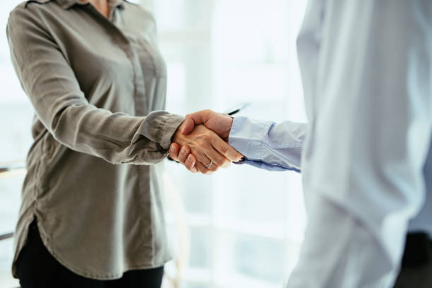 istock Real estate manager and salesman talking and shaking hands 1409277421