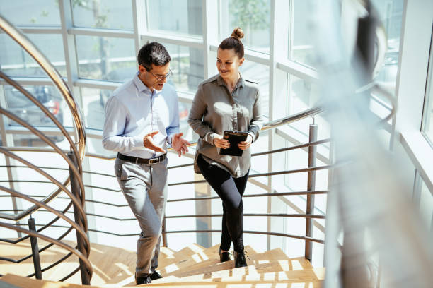 istock Real estate manager and salesman talking and shaking hands 1409277751