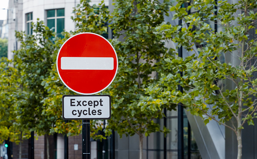 A no entry except for cycles sign in a city
