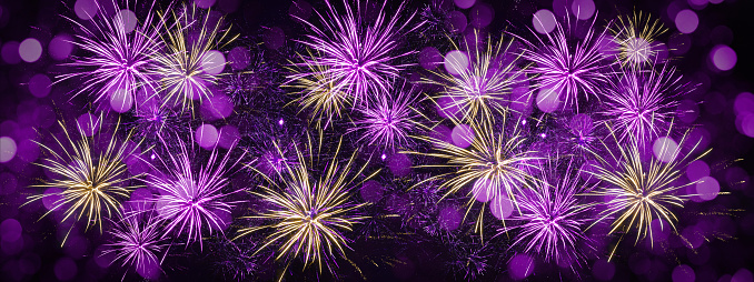 HAPPY NEW YEAR - Celebration New Year's Eve, Silvester 2023 holiday background panorama bannerr greeting card - Golden purple firework fireworks on dark night sky.