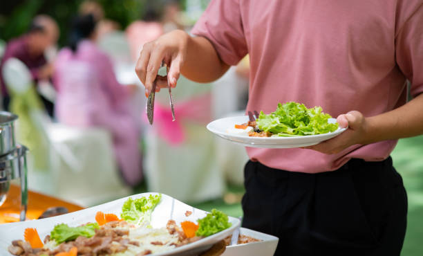 istock scooping the food, catering, dinner time 1409282817