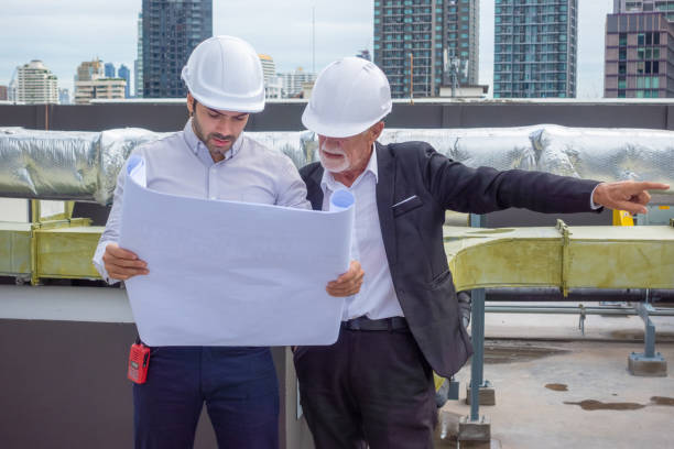 istock Engineer under checking the industry chilled water fan coil unit air conditioner is water cooling tower air chiller HVAC system of large industrial building to control air system 1409283809
