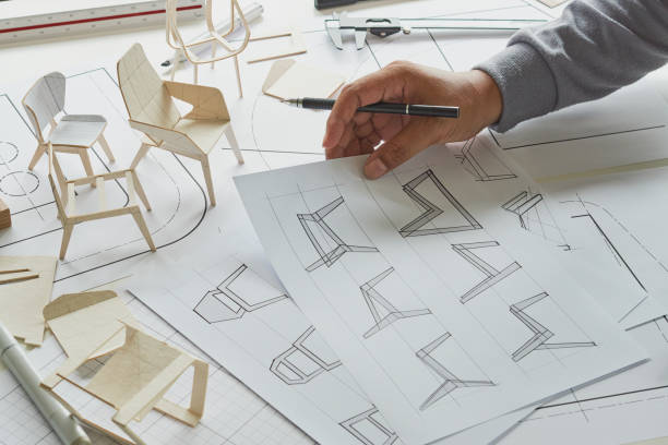 istock Designer sketching drawing design development product plan draft chair armchair Wingback Interior furniture prototype manufacturing production. designer studio concept . 1409284178