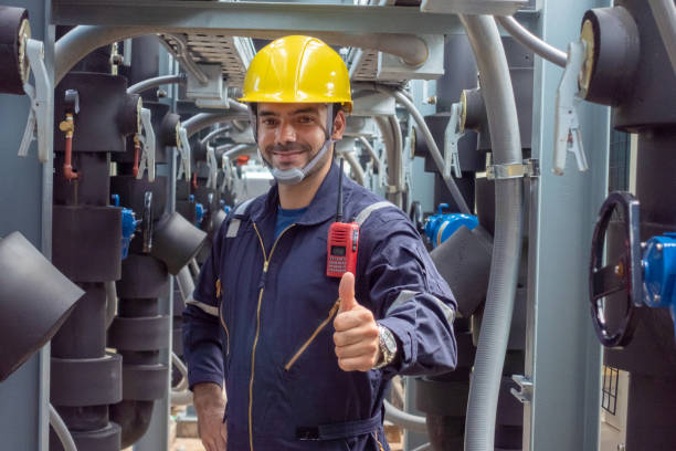 istock Engineer under checking the industry chilled water fan coil unit air conditioner is water cooling tower air chiller HVAC system of large industrial building to control air system 1409284390