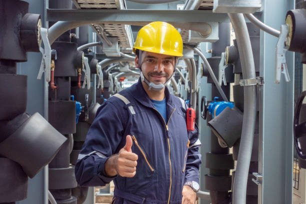 Engineer under checking the industry chilled water fan coil unit air conditioner is water cooling tower air chiller HVAC system of large industrial building to control air system
