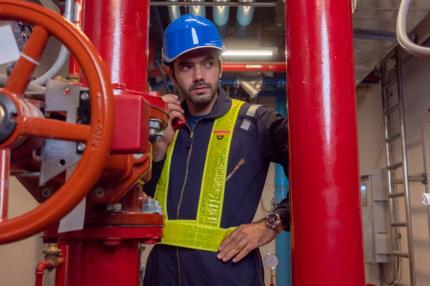istock Engineer under checking the industry chilled water fan coil unit air conditioner is water cooling tower air chiller HVAC system of large industrial building to control air system 1409284990