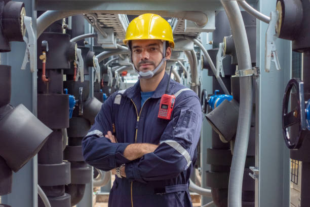 istock Engineer under checking the industry chilled water fan coil unit air conditioner is water cooling tower air chiller HVAC system of large industrial building to control air system 1409285141