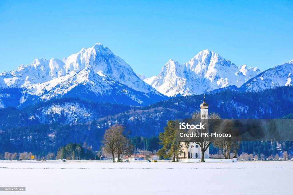 Famous Church St. Coloman in winter, Bavaria, Germany Famous St Coloman church near Schwangau, Bavaria, Germany European Alps Stock Photo
