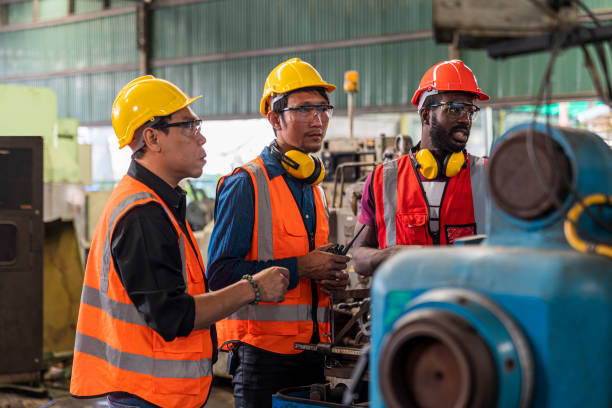 istock Metal worker teaching trainee on machine. Engineer men wearing uniform safety in factory. 1409289178