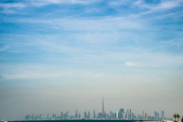 istock Building of Dubai visible from Palm Gumera 1409292235
