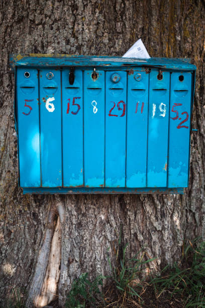 istock An old blue iron mailbox for mail and correspondence in the village. 1409293634