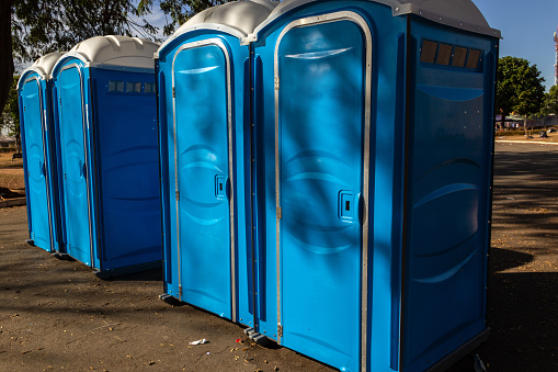 Goiania, Goiás, Brazil – July 17, 2022:  A few chemical toilets lined up in a square after a public event.