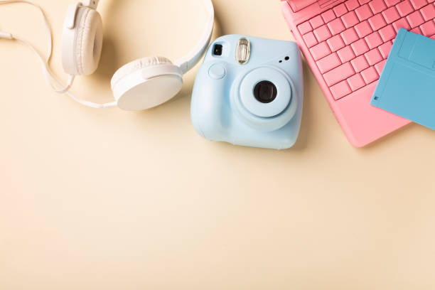 istock camera laptop headphones and floppy diskette in bright colors. 1409296115