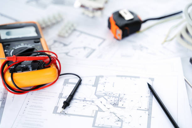 Making repairs,planning electricity project in house.Drawings,diagrams,plan for electrification of apartment, building. Devices and accessories, voltmeter, wires, screwdriver, pliers and tape measure
