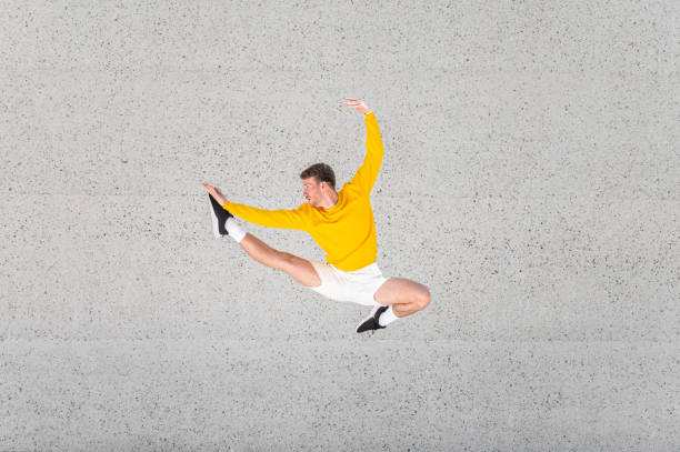 istock Male dancer in a jump 1409297652