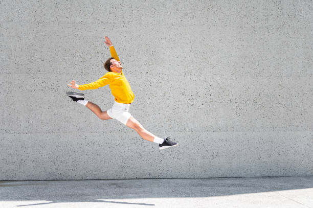istock Male dancer in a jump 1409297666