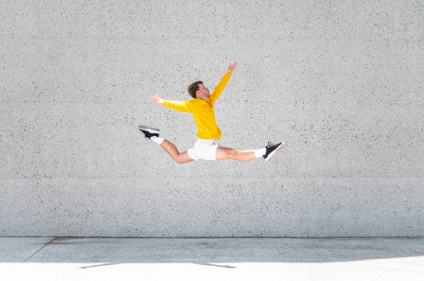 istock Male dancer in a jump 1409297669