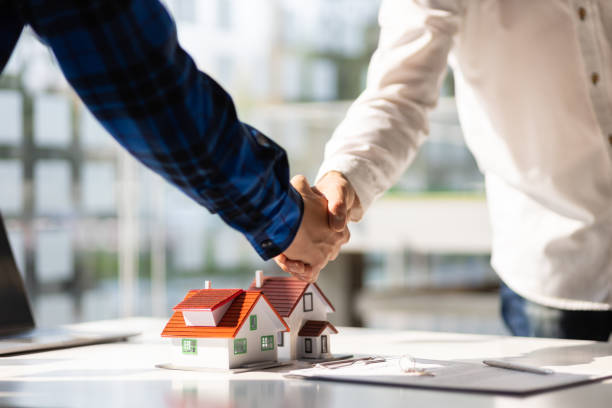 Mortgage broker closing a deal with a client