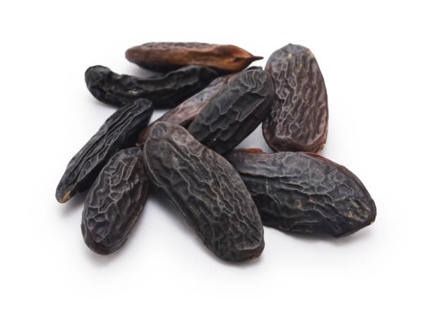 istock tonka beans  ( perfumery ingredients ) isolated on white background 1409300309