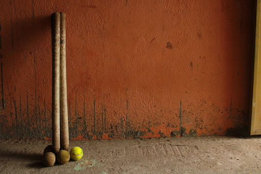 Cricket Ball And Bat Against wall
